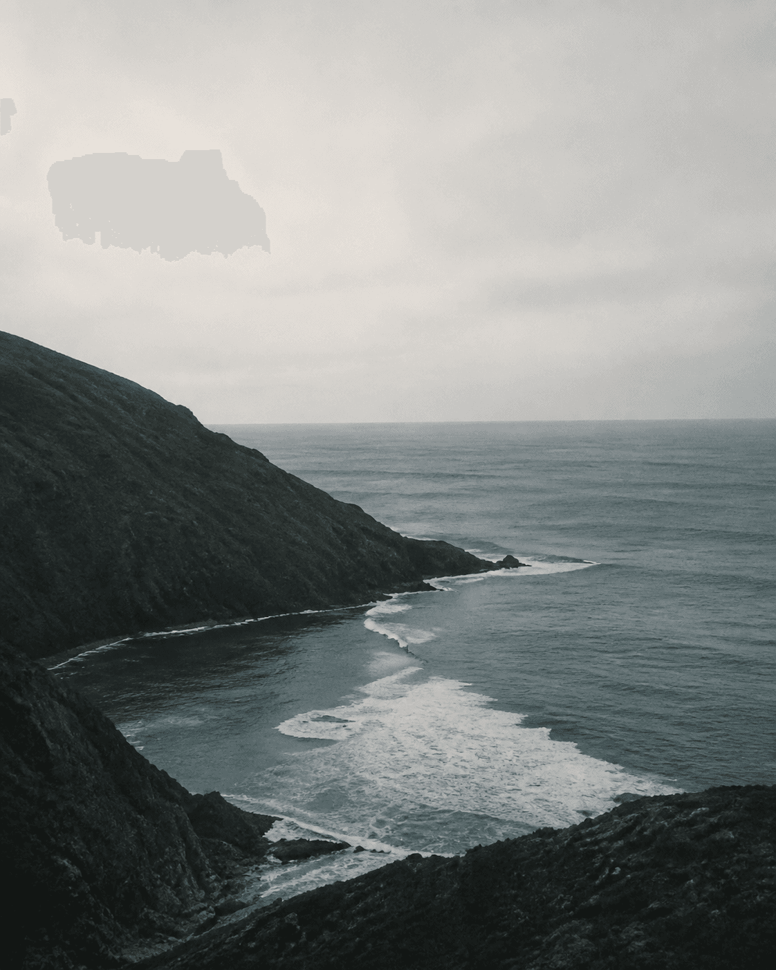 Muted rocky coastline and ocean